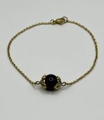 Catena in acciaio dorato con Su Coccu e Ossidiana 8 mm 🧿🖤