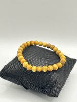 Bracciale elastico con perle da 6mm in legno di Palo Santo.
Favorisce purificazione, protezione e pace interiore. - immagine 2